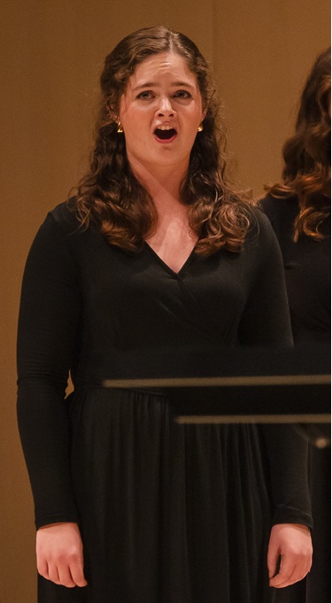 Ella S singing during a choir concert
