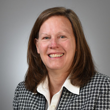 A professional headshot of Teresa Marshall