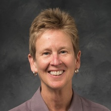 A professional headshot of Deb Tiemens.