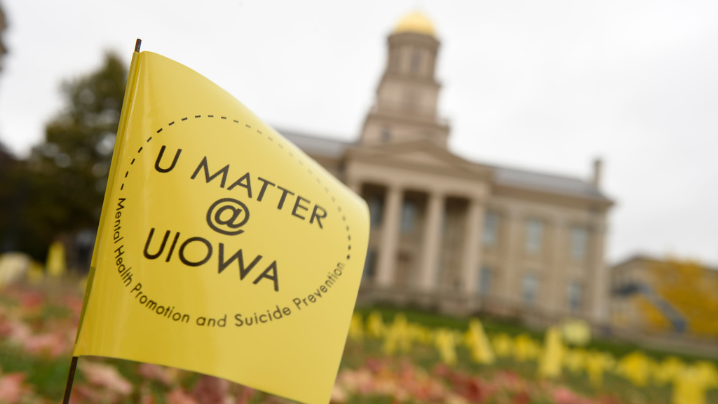 U Matter@Iowa flag with Old Capitol in the background.
